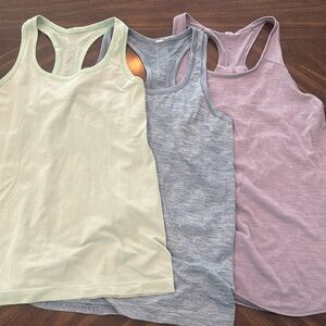 3 Lululemon Tanks: *⬇️ Shipping* Blue Swiftly sz6,Mint Swiftly sz8, Purple sz6